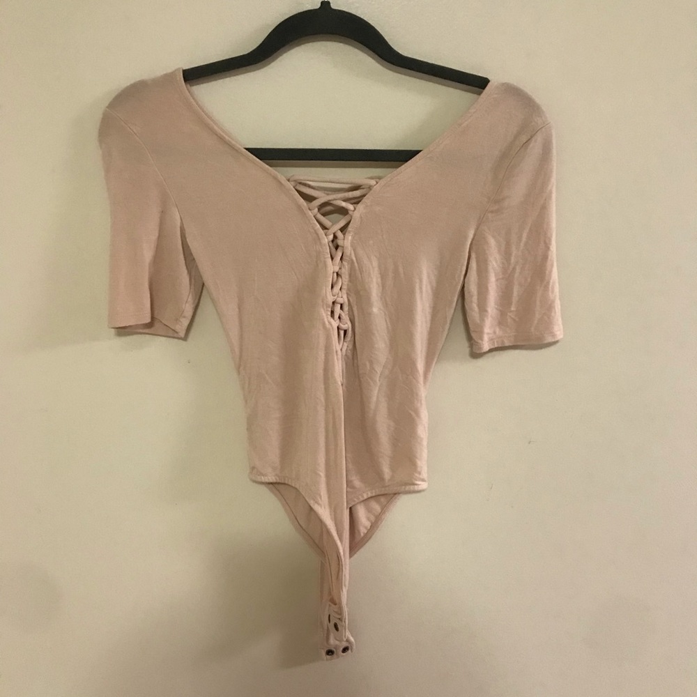 Nude laced body suit